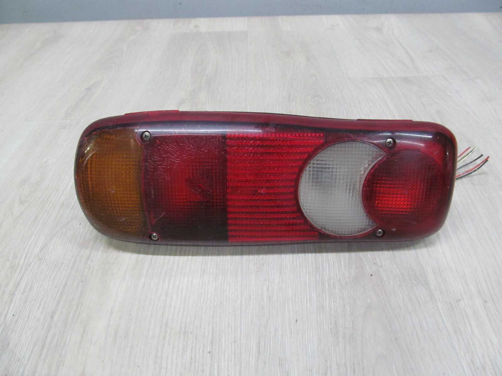 NISSAN CABSTAR MAXITY NT400 LAMPA TYL LEWA 26559X102 07-15