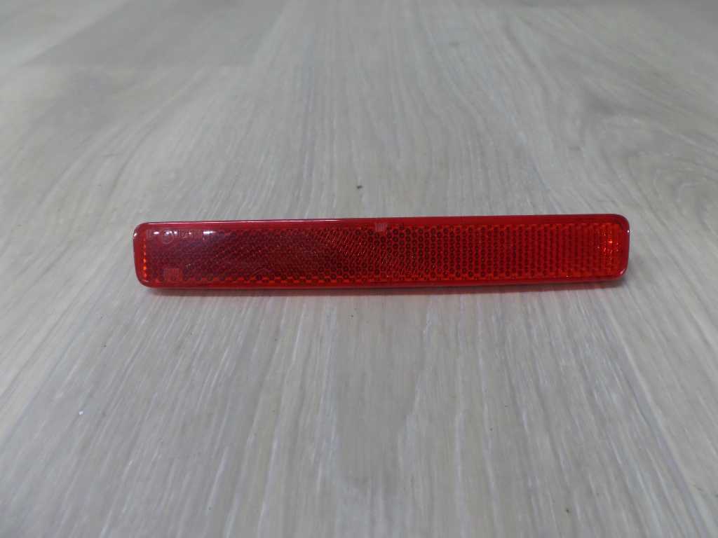 VW T5 03-15 ODBLASK ZDERZAKA TYL LEWY 7E0945105