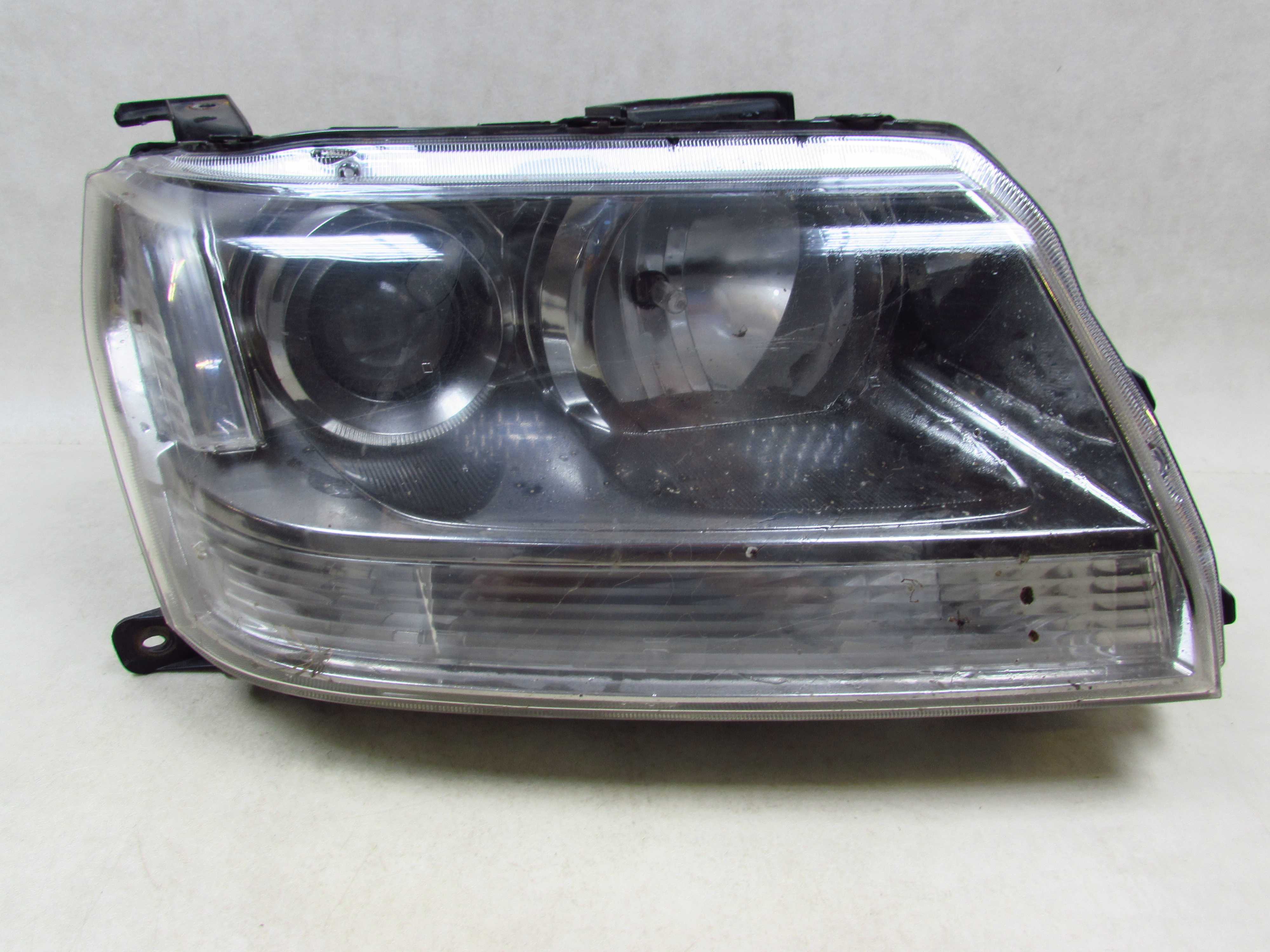 SUZUKI GRAND VITARA II 05-12 LAMPA PRZOD PRAWA REFLEKTOR UK 100-59079
